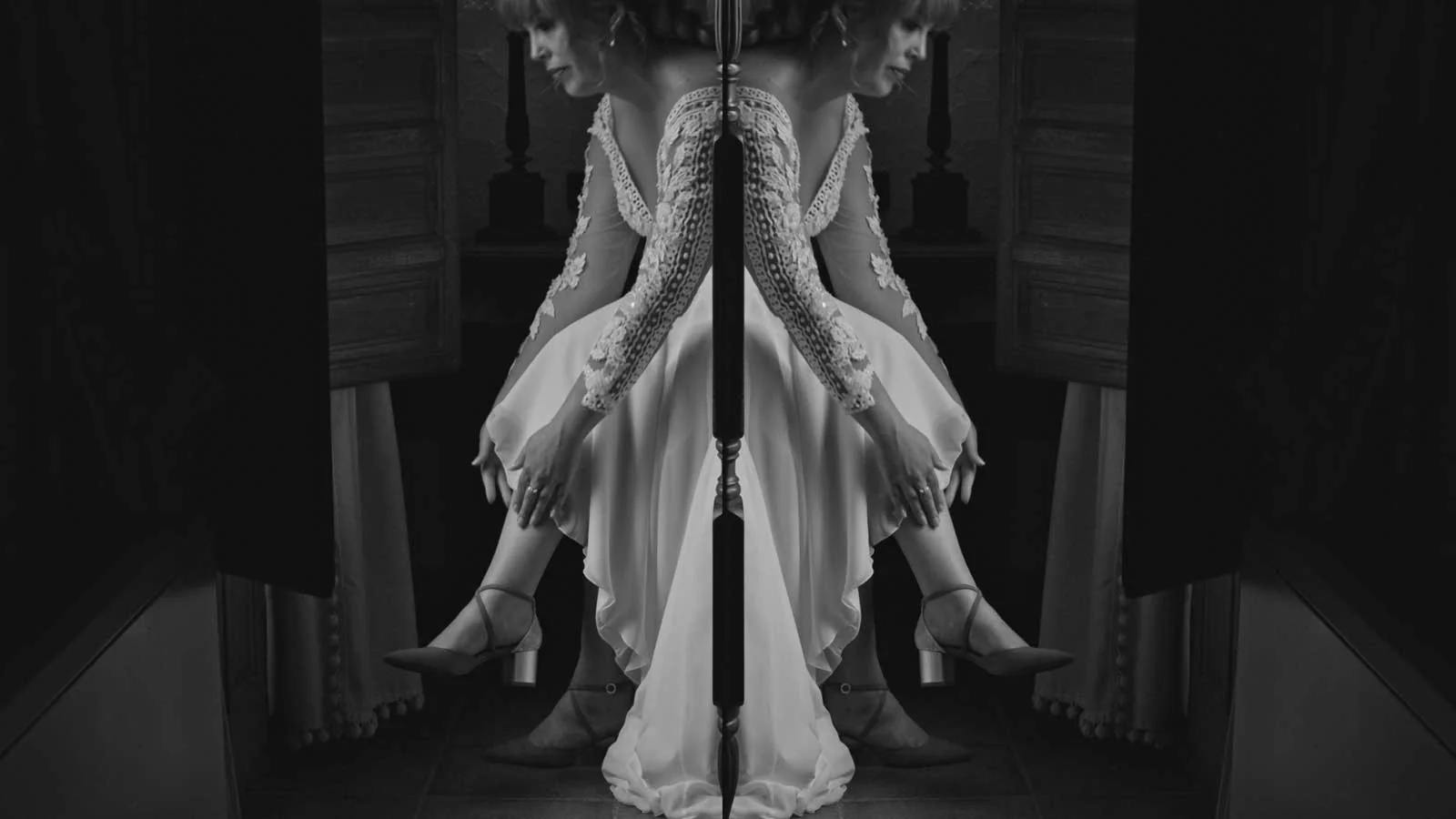 A mirrored black and white portrait of the bride moments before her Florida wedding ceremony.
