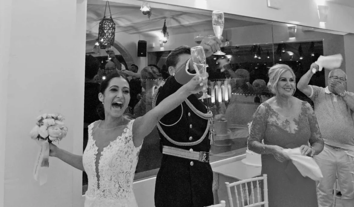 Champagne toast and big smiles — elegant reception moment.