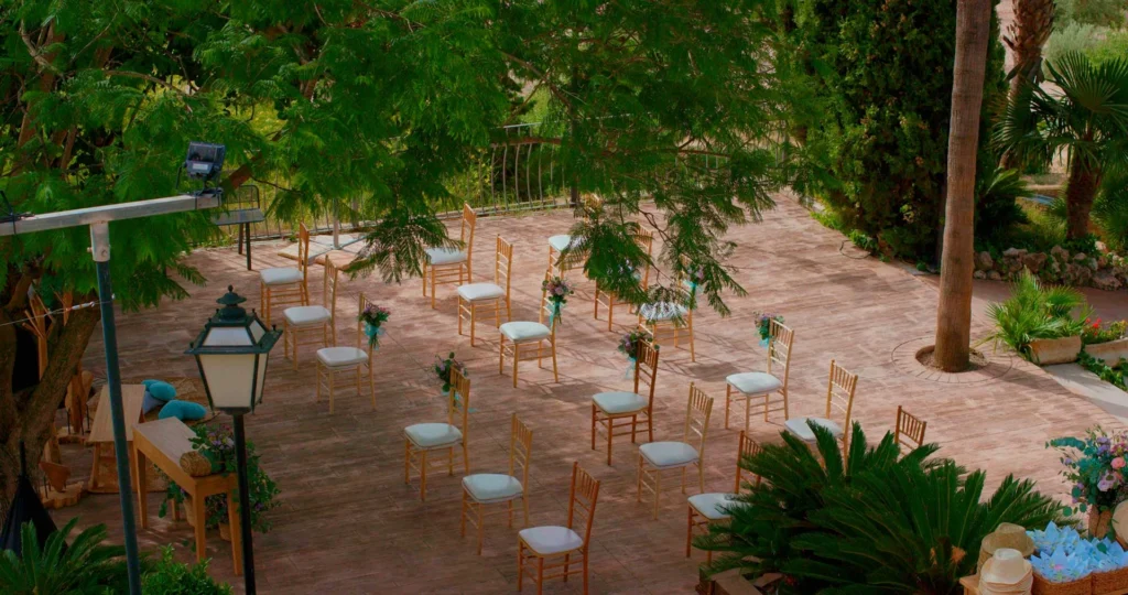 Airy terrace ceremony with elegant seating and fresh flowers—Tampa wedding photography for ceremony and reception details.