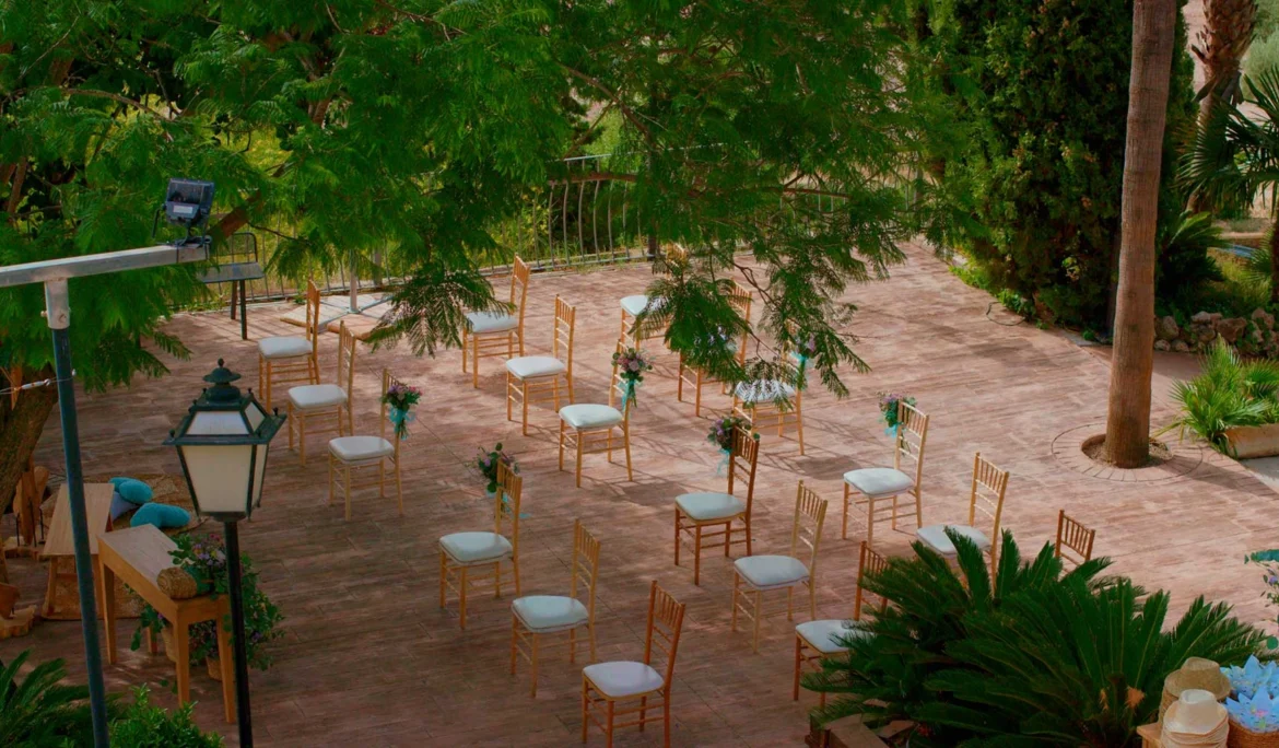 Airy terrace ceremony with elegant seating and fresh flowers—Tampa wedding photography for ceremony and reception details.