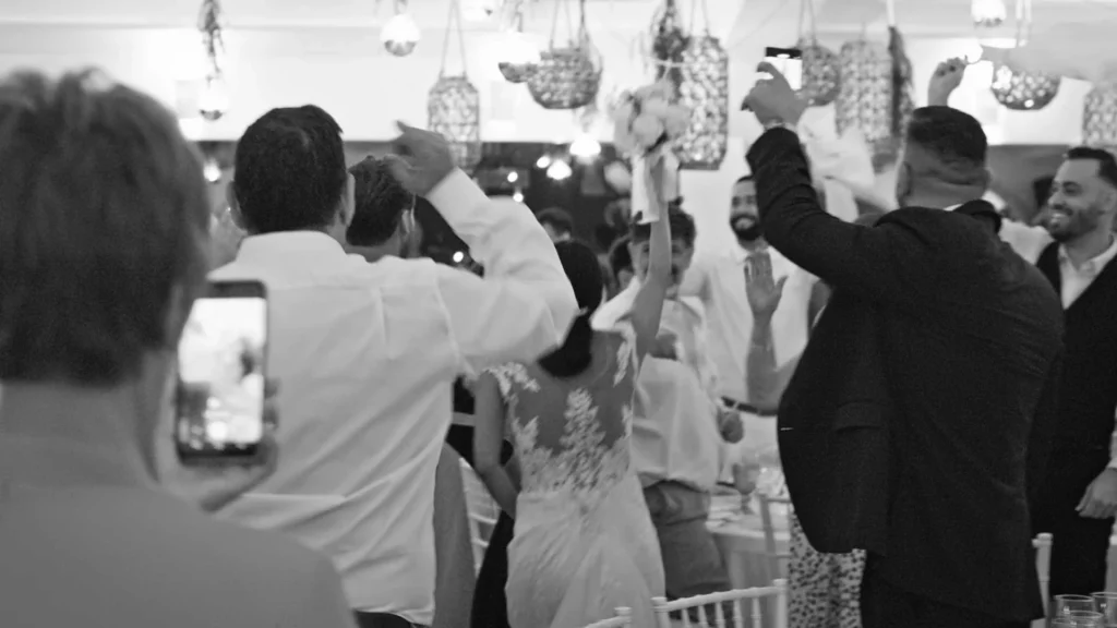 Reception entrance with cheers and movement — documentary wedding coverage, Tampa.